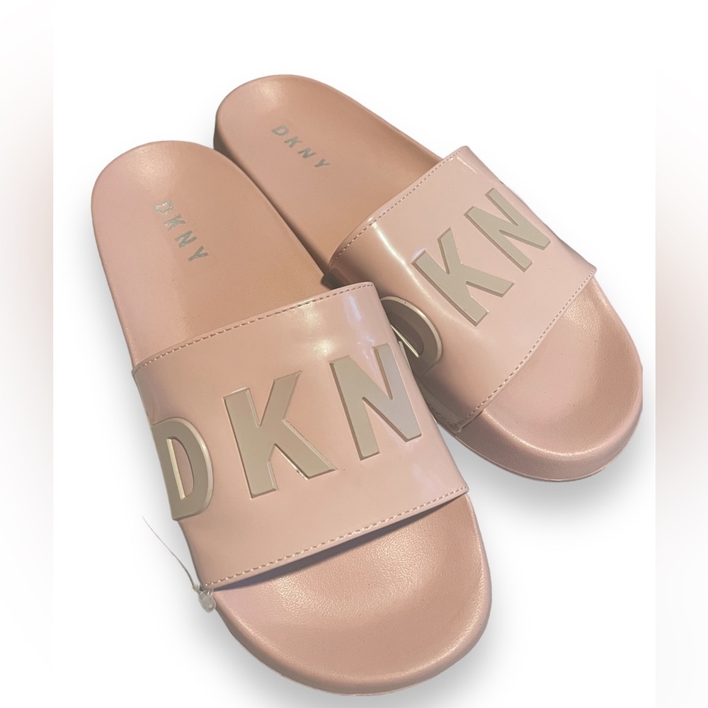 Womens size 7.5 light pink DKNY slides.